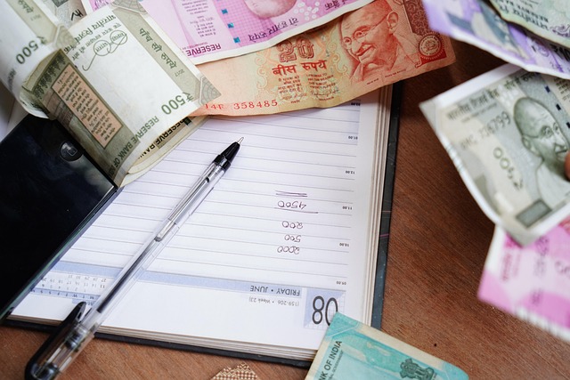 hands holding budgeting notebook and calculator in Mexico